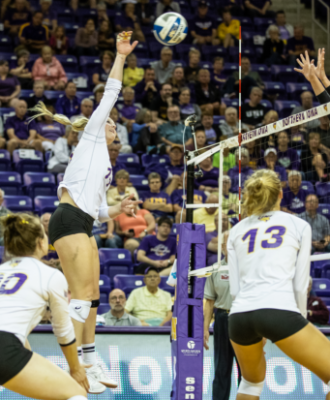 UNI Volleyball player spiking the ball